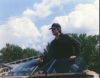 This is a photo of me, way back, with long hair and racecar...I will post more eventually.