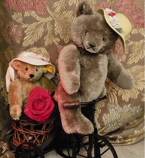 Cute Teddy Bears on a bike.