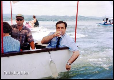 Mayor drinking water from the lake