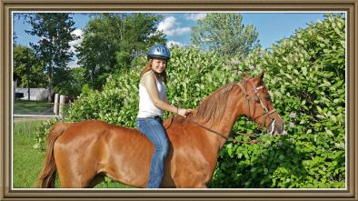 Leah loved riding her horse around the farm.