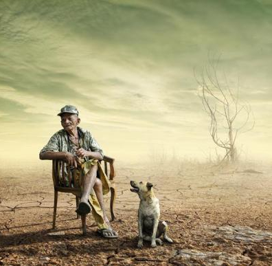 Man and dog in drought-stricken scene