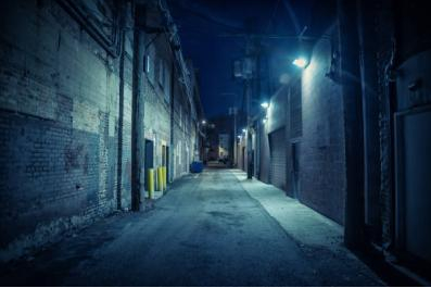 Photograph of a dingy back alley.