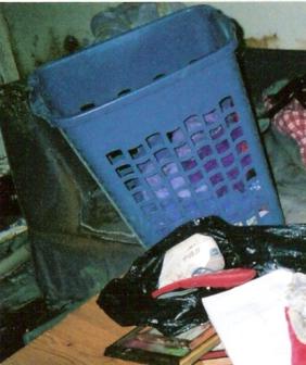 A Complete Mess ~ A laundry hamper was one of many items left in an awkward position after the flood water was gone. 
