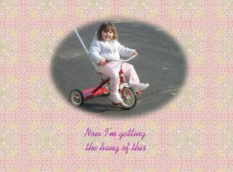 First Success ~ When Emma got her tricycle, early April, it took her several days to get the hang of using her feet to pedal.  This was her first success and she was delighted, as was I.  *Smile*