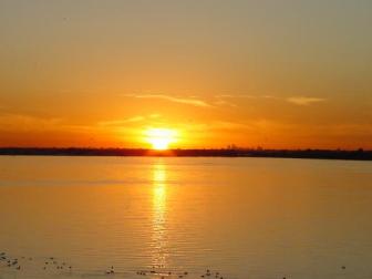 Sunset ~  Sunset over Lake Ray Hubbard in Rockwall, TX. Just to the right of the sun, and about twenty five miles from the camera, is the Dallas skyline. 