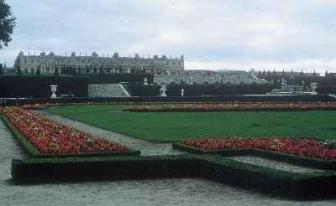 Versailles ~ The Palace at Versailles as viewed from the gardens.  

Actually a suburb of Paris located 20 kilometers southwest of the city, Versailles became the centre of political power in France when Louis XIV moved there from Paris in 1682.