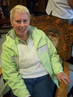 Connoisseur of comfort ~  The lucky bidder of this rocking chair sitting in her prize. A bidding war ensued, but for $255, she won! Silent auction was at Methodist Camp on Flathead Lake, Montana on Sunday, April 26, 2010. Their goal was to raise $5,000. They just may have. *Smile*

The rocking chair has a picture of a cat... and we all know how cats choose their favorite spot. As it is written across the top: the "connoisseur of comfort". 